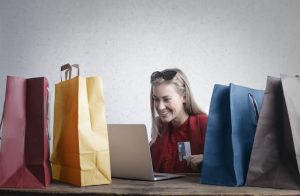 a woman is happy after buying online. This is one of the reasons people buy online.